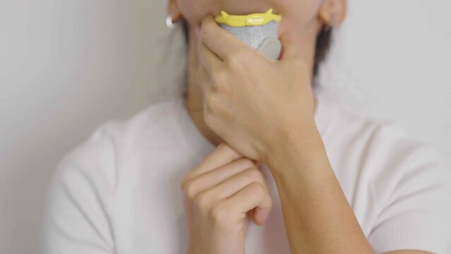 Woman holding human Thyroid anatomy model with her Neck. Hyperthyroidism, Hypothyroidism, Hashimoto Thyroiditis, Thyroid Tumor and Cancer, Postpartum, Papillary Carcinoma and Health concept