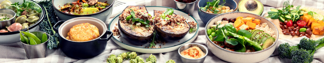 Vegetarian and various vegan dishes on light table. Healthy food concept with vitamins, fiber and antioxidants.