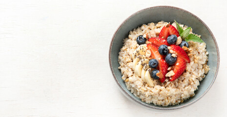Healthy homemade oatmeal with berries for breakfast.