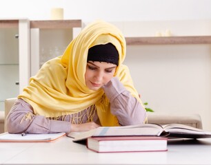 Female student in hijab preparing for exams