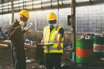 Chemical leak and safety first concept. Group of chemical specialist wear safety uniform, gas mask inspecting chemical leak in industry factory. Two scientists checking quality of liquid in plant