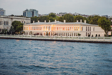 Naklejka premium landscape scenery of Dolmabahce palacewith reflection, istanbul, turkey waterfront view from bosporus