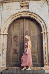 Woman tourist in Old town Kaleici in Antalya. Turkiye. Panoramic view of Antalya Old Town port, Taurus mountains and Mediterrranean Sea, Turkey