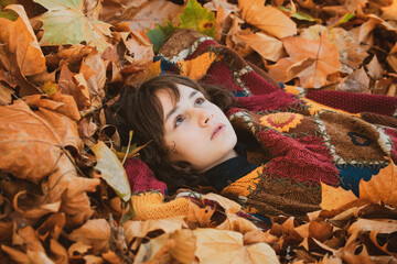 Fall time. Portrait of beautiful young woman in autumn leaf. Autumn dream. Woman dreams in autumn fall. Beauty girl dream. Daydreamer woman. Dreams and imagination. Dreamy female model.