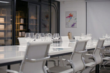 Empty wine glasses on the table, preparation for tasting and staff training. Alcoholic beverage degustation room. 