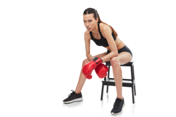 Tired woman, boxer and break on chair after workout isolated on a transparent PNG background. Portrait of exhausted female person or fighter with boxing gloves sitting in timeout, break or rest