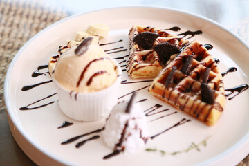 Waffle get served in the morning in the restaurant or the cafe. Food and drink set made by chef and served with hot drink. Healthy food or junk food was select by people.