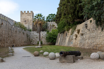 Cannon and trebuchet, catapult stones and walls in the moat of old town city of Rhodes, Greece