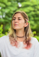 Portrait of beautiful woman with pink hair looking sideways