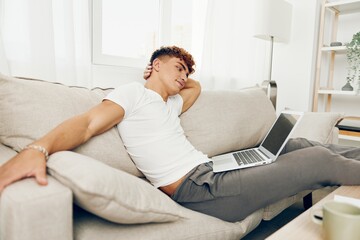 man interior male sitting phone education typing cyberspace looking t-shirt happy using