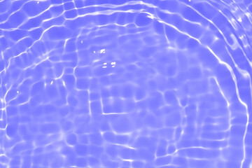 Purple water with ripples on the surface. Defocus blurred transparent pink colored clear calm water surface texture with splashes and bubbles. Water waves with shining pattern texture background.