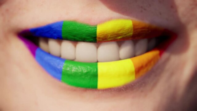 Close up of sexy caucasian woman perfect lips with rainbow lipstick. LGBT, lesbian love and pride concept. 3d render