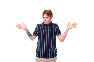 young blond man in a tank top shrugging his shoulders on a white background