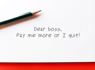 Office paper with handwritten text DEAR BOSS, PAY ME MORE OR I QUIT ,Workers salary negotiation with bosses, offer to stay if receiving a salary increase