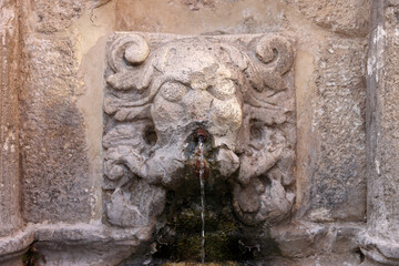 Fototapeta na wymiar Rimondi Fountain in Old Town of Rethymnon in hot summer day. Crete, Greece.