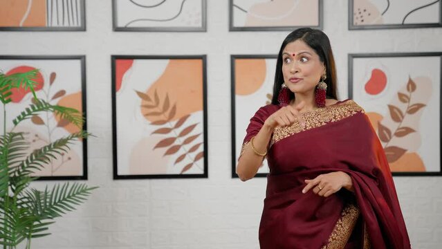 Indian woman pointing for product placement