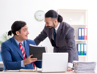 Two male colleagues in the office