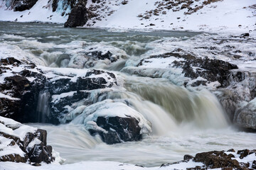 Landscape with snow and waterfall in Iceland