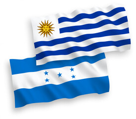 Obraz premium Flags of Oriental Republic of Uruguay and Honduras on a white background