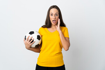 Young football player woman over isolated white background with surprise and shocked facial expression