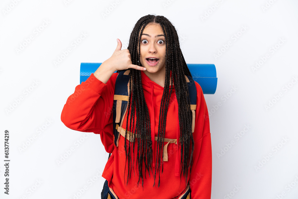 Wall mural Hiker teenager girl with braids over isolated white background making phone gesture. Call me back sign