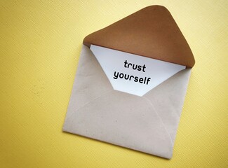 Crd in envelope with text written TRUST YOURSELF, positive affirmation to build self-trust, being...