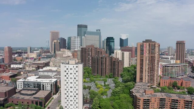 Wide aerial dolly shot of the Minneapolis skyline in Minnesota. 4K