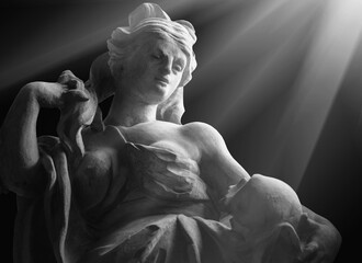 Black and white image of beautiful woman with skull as symbol of figure of Death and end of human...