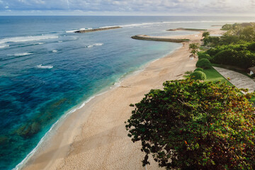 Obraz premium Holiday beach with ocean and sunshine in tropical island. Aerial view
