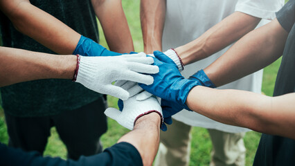 teamwork unity concept A group of friends joined hands in a campaign to help the community collect garbage. To conserve nature and the environment, love the world