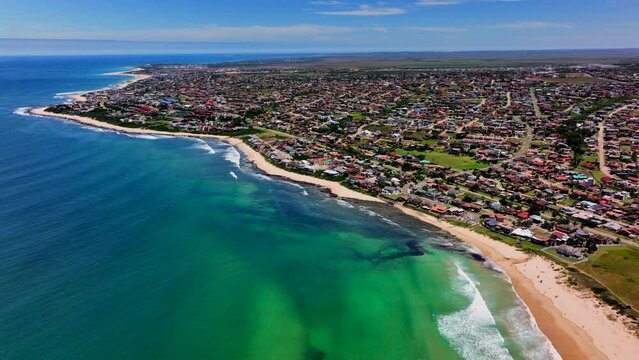 South Africa JBAY Jeffreys Bay aerial drone town homesmost stunning white sand beach epic surf wave saturated aqua blue rugged reef coastline daytime WSL Corona Open Supers Boneyard summer backwards