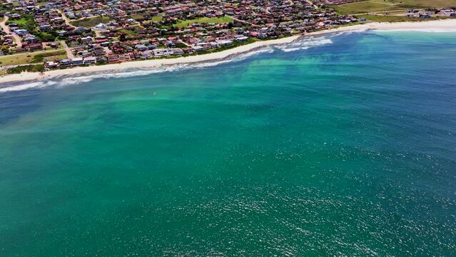 South Africa JBAY Jeffreys Bay aerial drone town homesmost stunning white sand beach epic surf wave saturated aqua blue rugged reef coastline daytime WSL Corona Open Supers Boneyard summer up forward