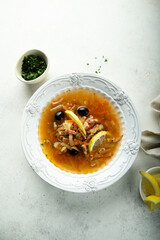 Traditional homemade soup with sausage and capers