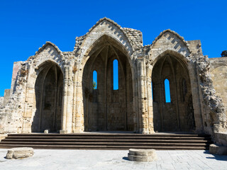 Naklejka premium Front view at Ruins of the choir of the gothic church of the Virgin of the Burgh. Medieval city of Rhodes, Greece