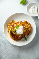 Traditional homemade latkes with sour cream