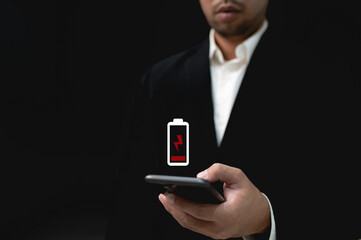 Battery low message on mobile device screen. Internet and technology concept