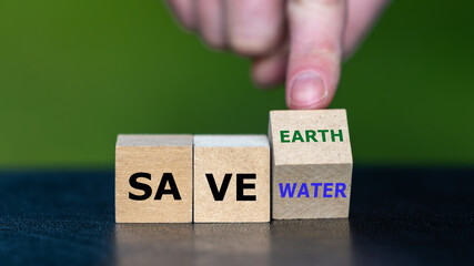 Wooden cubes form the expression 'save water' and 'save earth'.