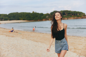 young woman beach sea sunset ocean smile sand summer lifestyle vacation