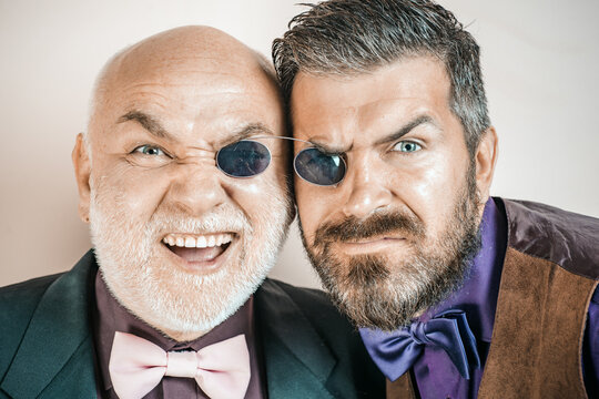 Fummy male couple. Men joking. Comic and humor sense. Men with beard and mustache mature hipster wear funny eyeglasses. Humor concept. Funny story and humor. Comic idea.