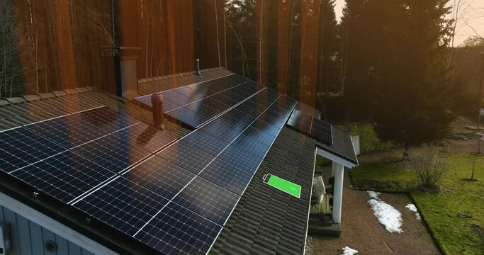 Aerial view of sun rays hitting a solar panels, generating electricity for a house