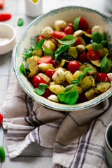 Italian Caprese salad with gnocchi and vegetables.. .style rustic