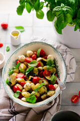 Italian Caprese salad with gnocchi and vegetables.. .style rustic