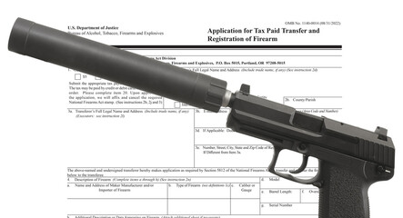Silencer on a semi-auto pistol with public domain form to own one
