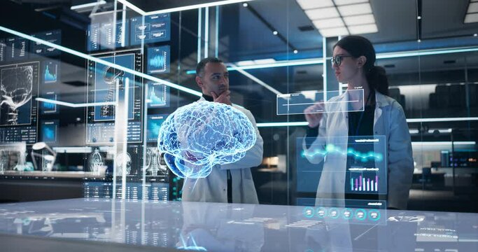 Two Neuroscientists Working With Computer-Powered Animated VFX Hologram Of Human Brain And Nervous System In Futuristic Laboratory. Multiethnic Man And Woman Working On Solutions for Brain Tumor.