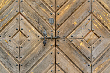 Detailed background image of an old wooden door