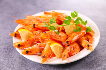 plate of fresh shrimp, lemon and herbs