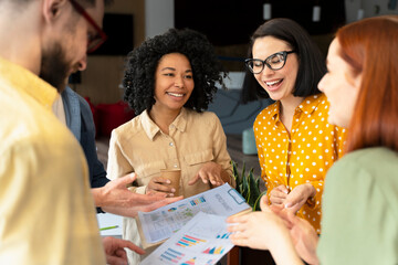 Group smiling multiracial business people talking, cooperation, sharing ideas, planning startup...