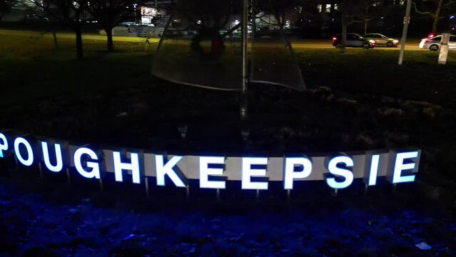 Aerial Night Pan Right Shot of the Poughkeepsie New York Sign