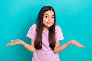 Photo of funky preteen child cute girl shrug shoulders no idea confused dilemma misunderstanding...