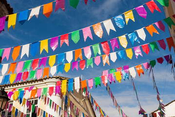 Old buildings in Pelourinho decorated with colorful flags for the feast of Sao Joao